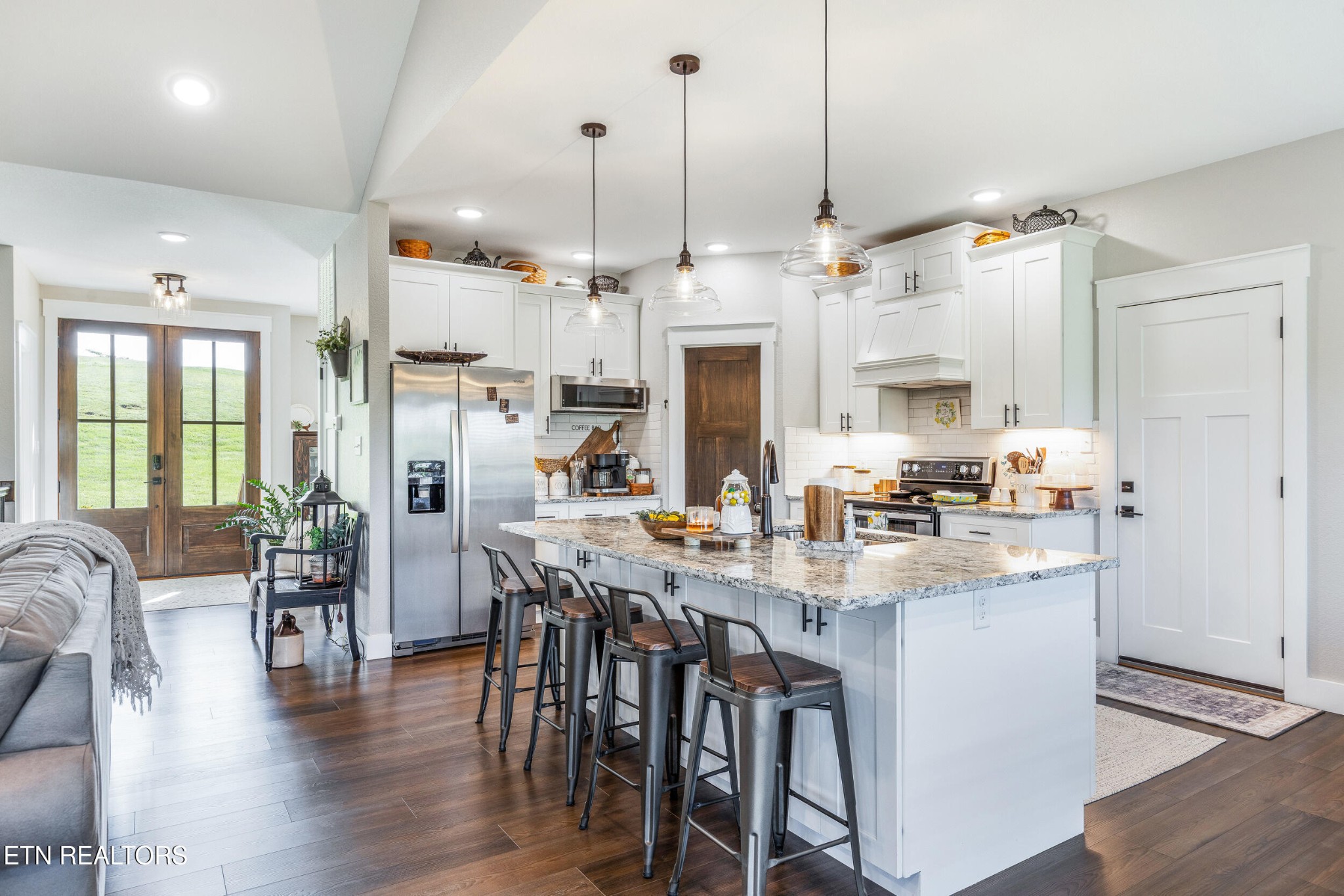 1866 Holston River Drive Rutledge, TN 37861 - Photo 14 of 54 a kitchen with stainless steel appliances kitchen island granite countertop a table chairs and a refrigerator