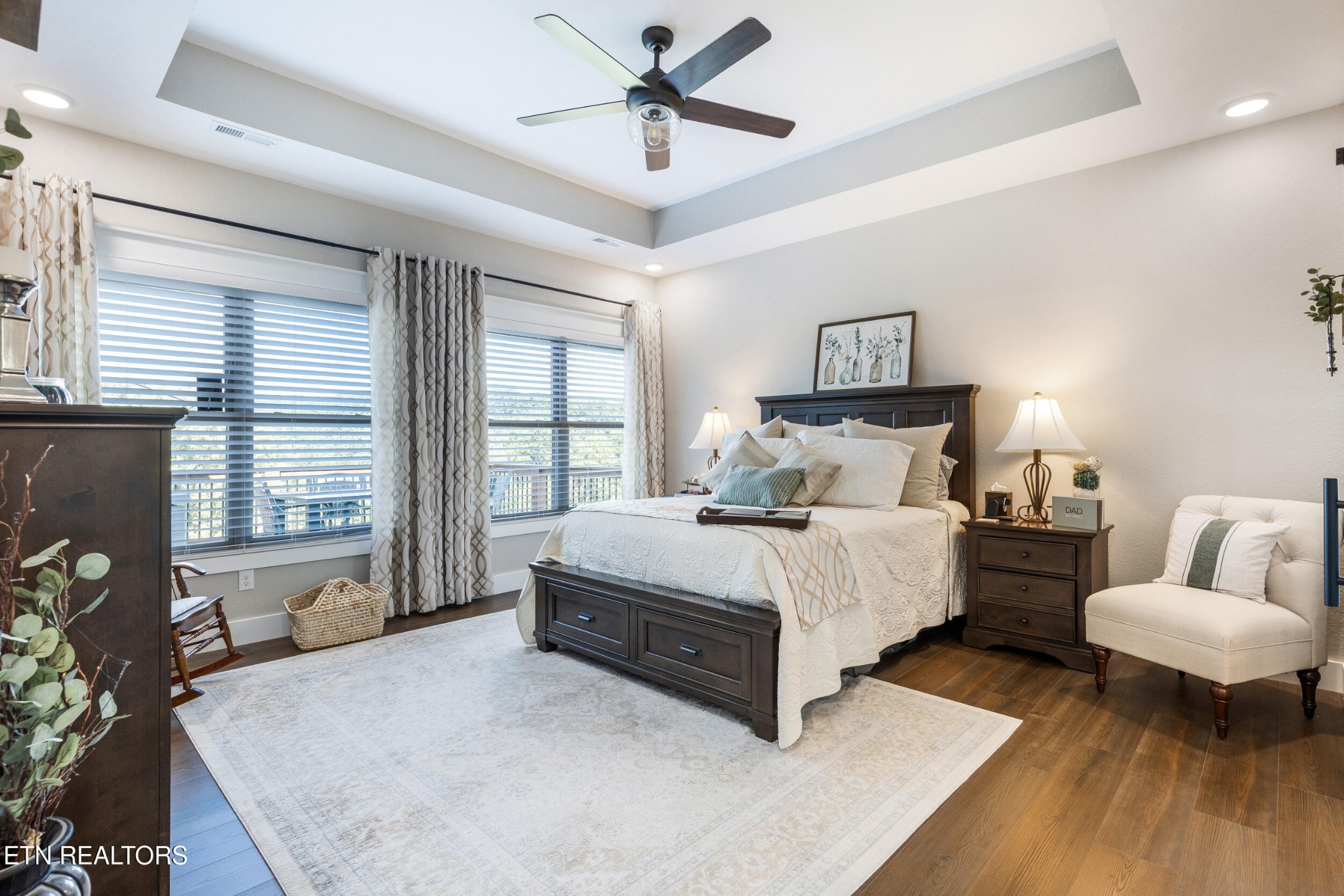 1866 Holston River Drive Rutledge, TN 37861 - Photo 20 of 54 a spacious bedroom with a bed a couch and a window