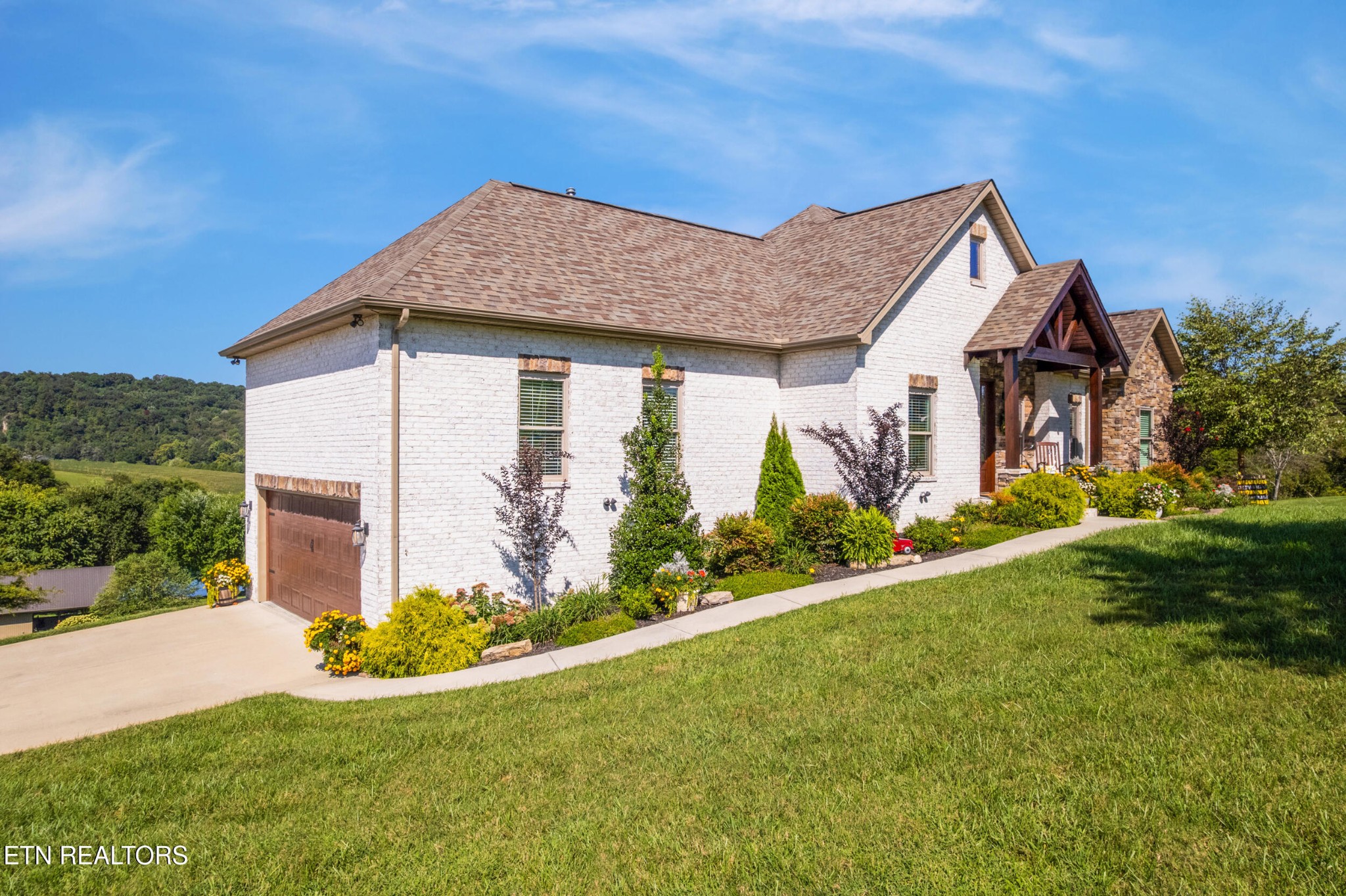 1866 Holston River Drive Rutledge, TN 37861 - Photo 2 of 54 a front view of house with garden