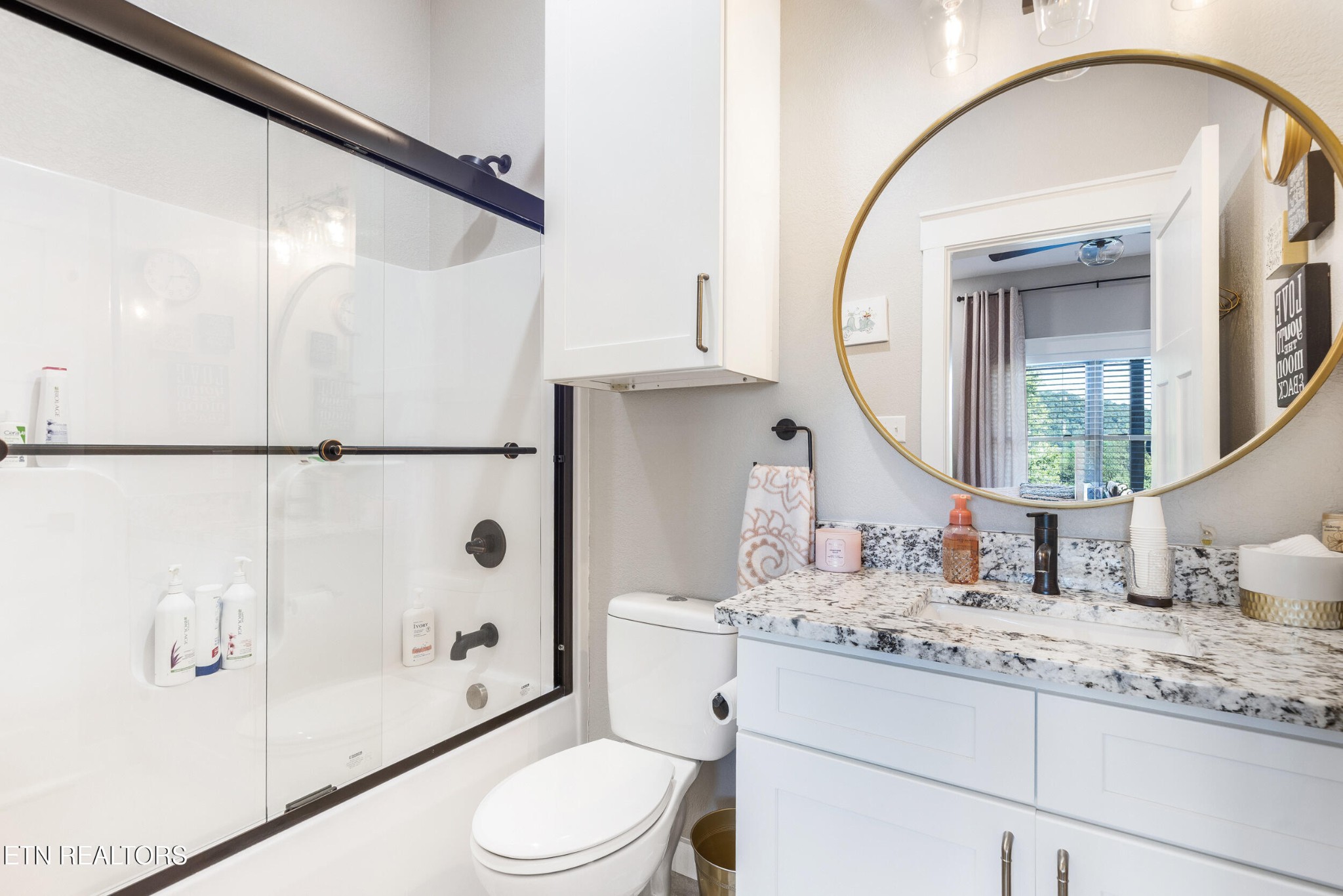 1866 Holston River Drive Rutledge, TN 37861 - Photo 32 of 54 a bathroom with a granite countertop sink a toilet and shower