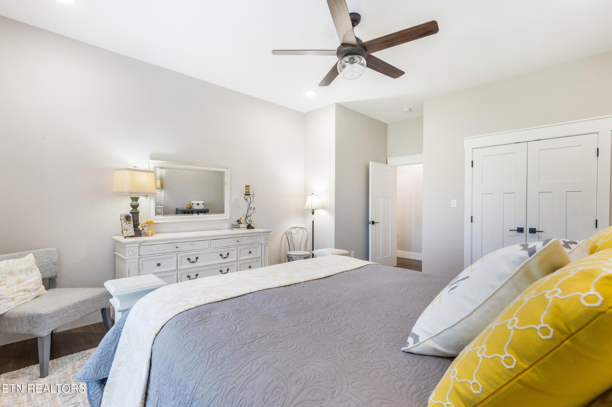 1866 Holston River Drive Rutledge, TN 37861 - Photo 36 of 54 a bedroom with a bed a lamp and a chandelier