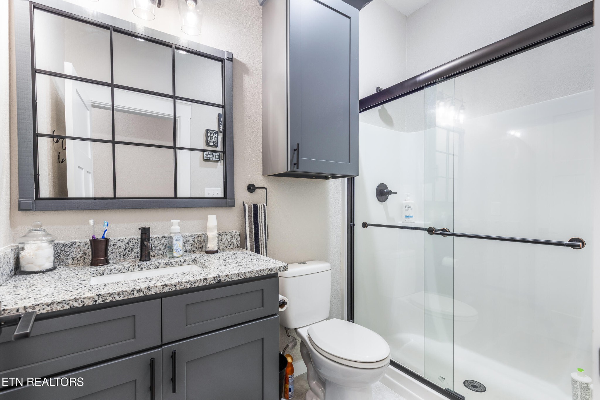 1866 Holston River Drive Rutledge, TN 37861 - Photo 37 of 54 a bathroom with a granite countertop sink mirror vanity and toilet