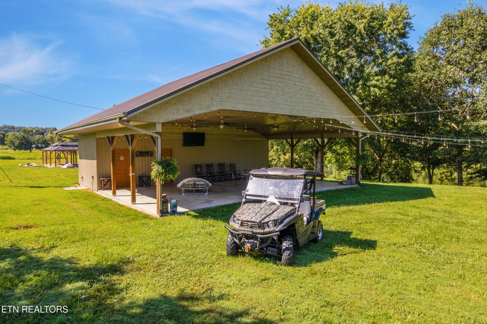 1866 Holston River Drive Rutledge, TN 37861 - Photo 40 of 54 a backyard of a house with yard and outdoor seating