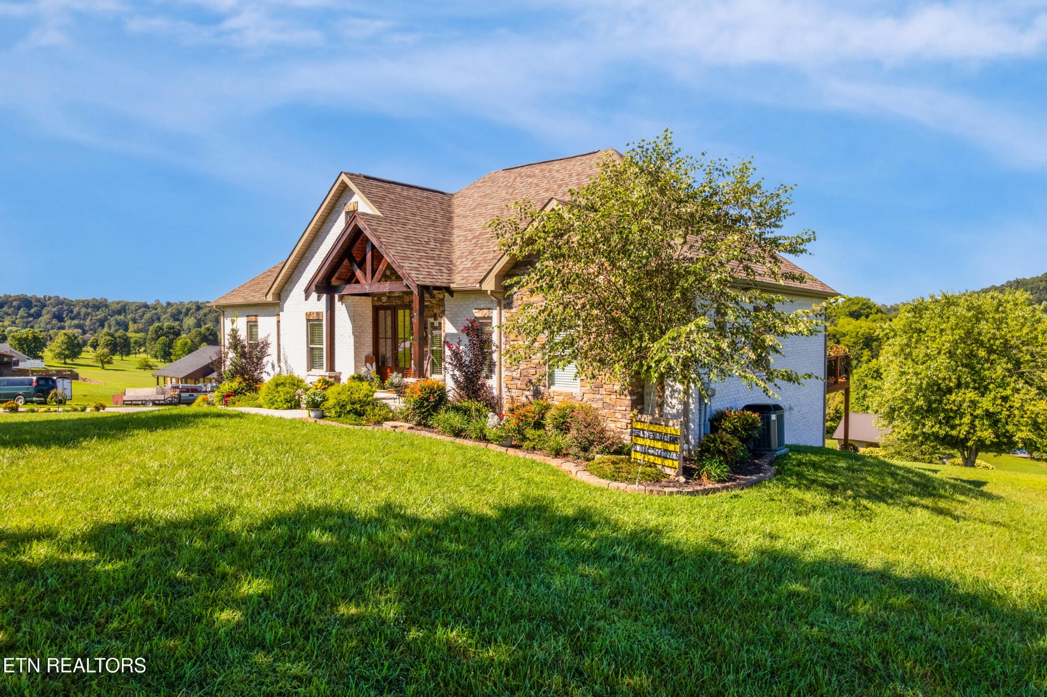 1866 Holston River Drive Rutledge, TN 37861 - Photo 5 of 54 a view of a house with a big yard and large trees