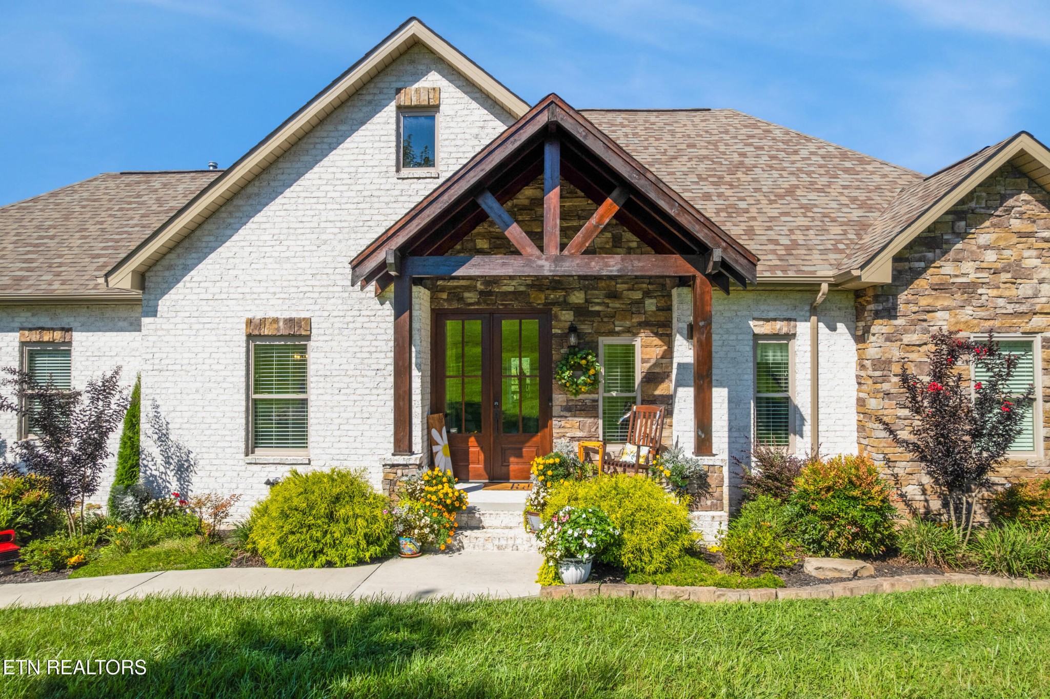 1866 Holston River Drive Rutledge, TN 37861 - Photo 6 of 54 a front view of a house with a yard and porch