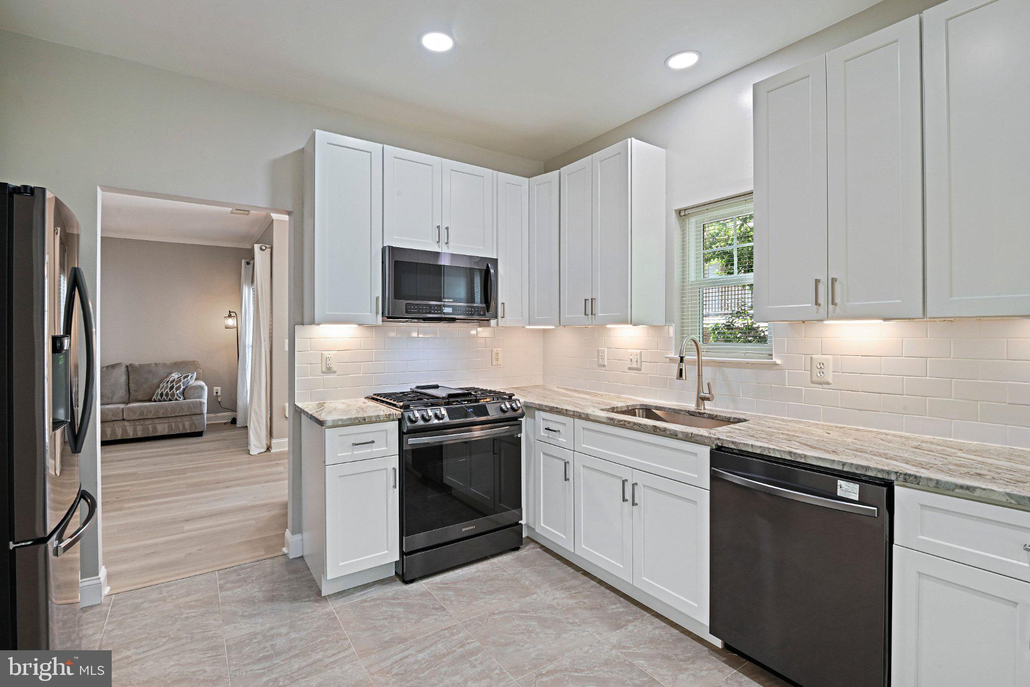 1519 North Point Drive, Unit 202 Reston, VA 20194 - Photo 17 of 49 Modern kitchen with sleek finishes.