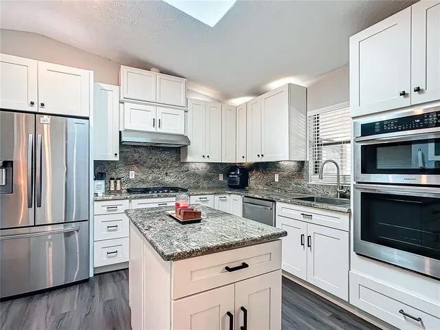 a view of workspace with furniture and windows
