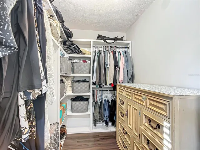a view of a living room and floor to ceiling windows