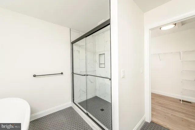 a white bath tub sitting next to a window