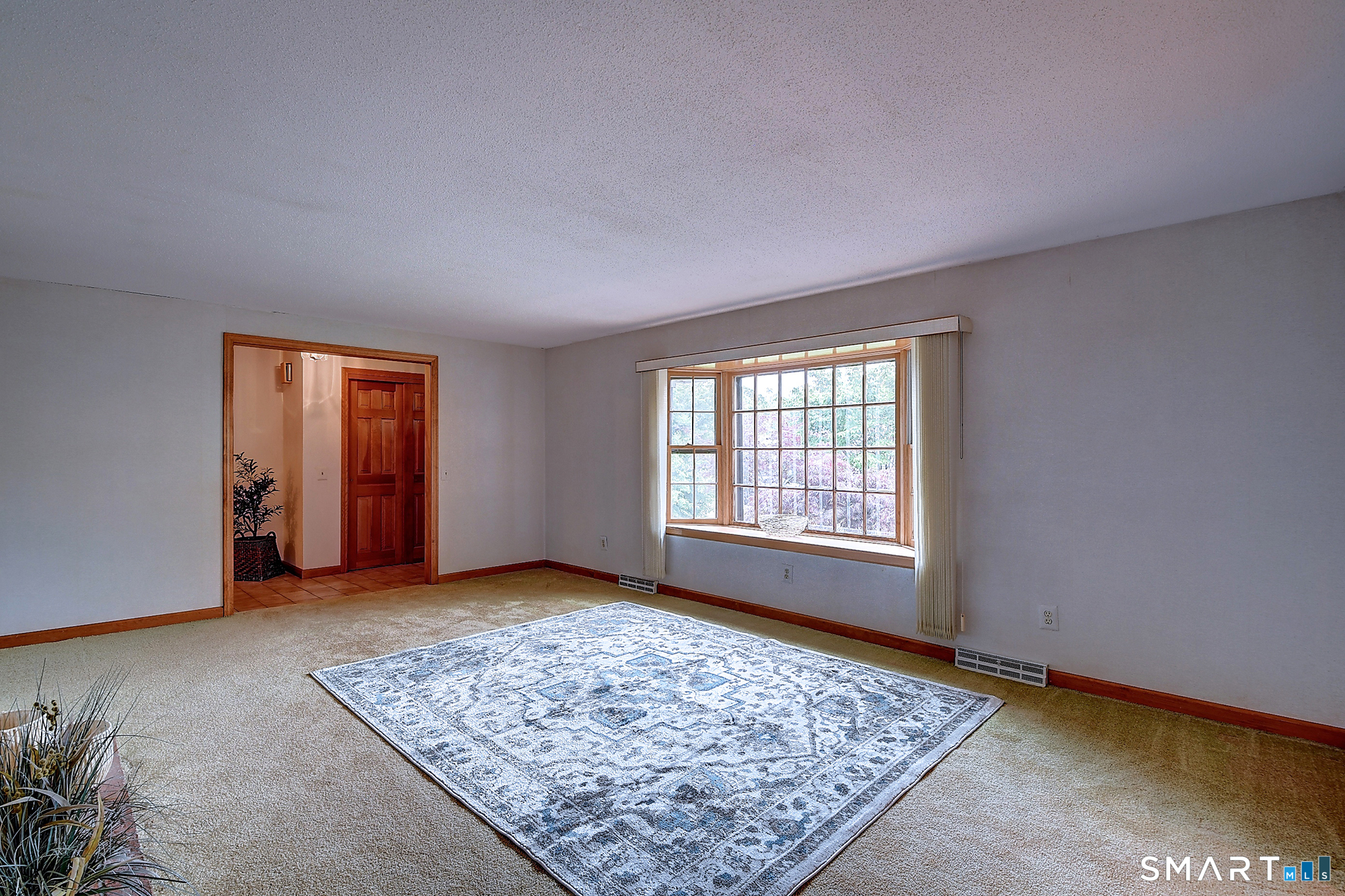 80 Grist Mill Road Wethersfield, CT 06109 - Photo 8 of 40 a view of an empty room with window