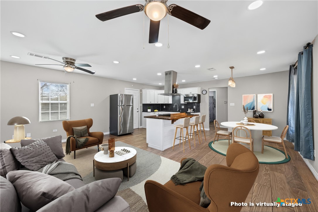 2716 McKenzie Avenue Waco, TX 76708 - Photo 10 of 31 Virtually staged family room and dining