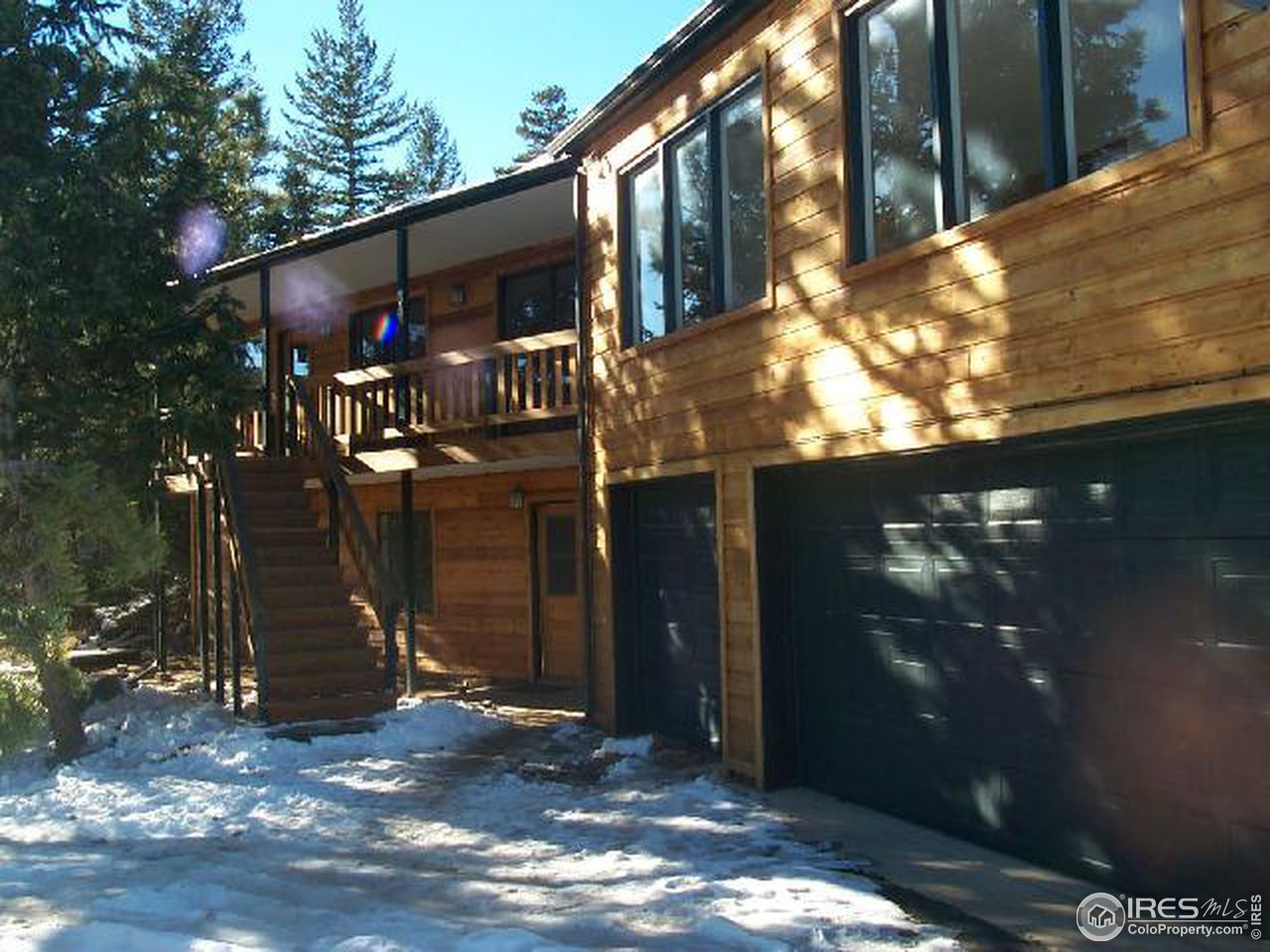 a view of a house with a tree