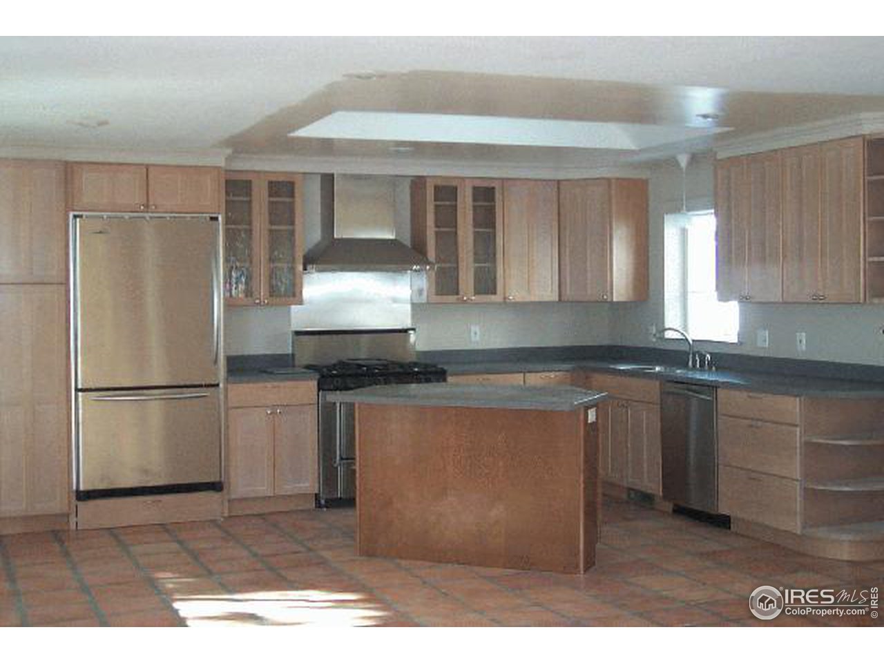 598 Deer Trail Road Boulder, CO 80302 - Photo 2 of 7 a kitchen with stainless steel appliances granite countertop a refrigerator a sink and a stove