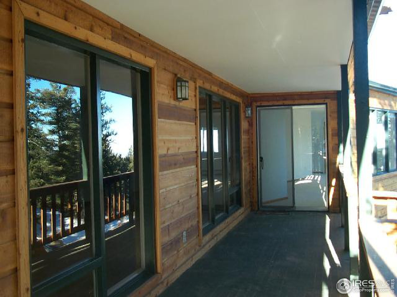 598 Deer Trail Road Boulder, CO 80302 - Photo 4 of 7 a view of porch with a floor to ceiling window