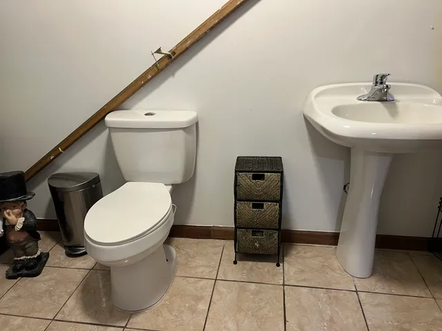 a bathroom with a toilet and a sink