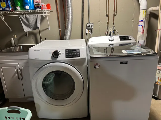 a utility room with dryer and washer