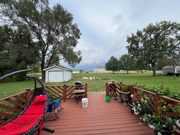 an outdoor space with furniture and garden