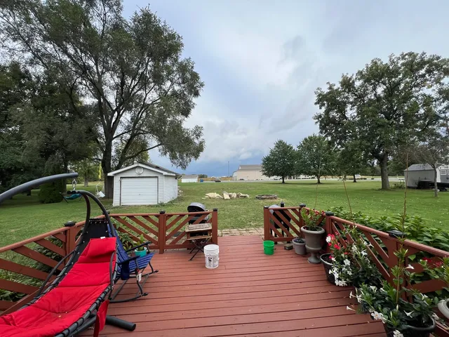 an outdoor space with furniture and garden
