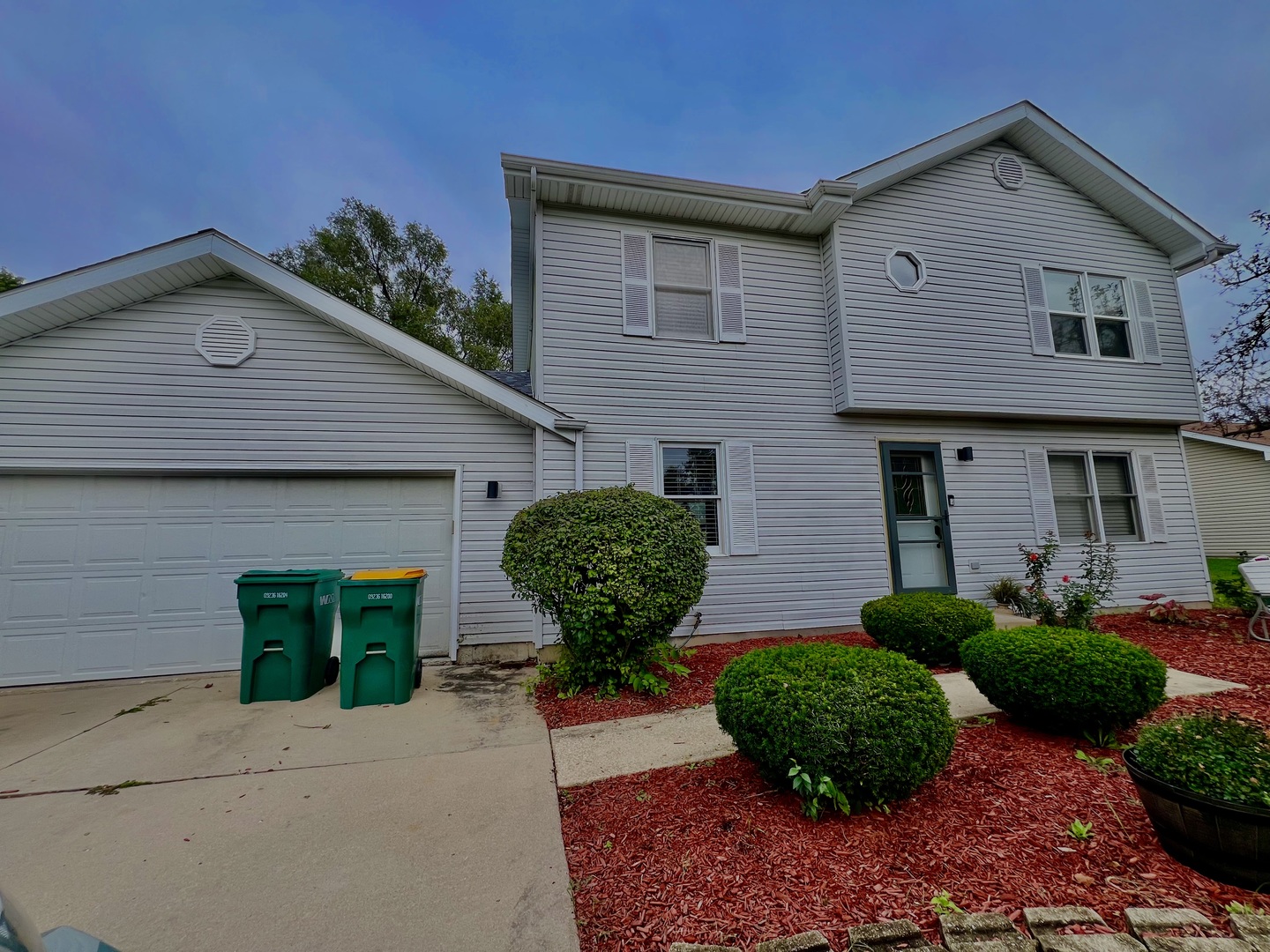 810 Peale Street Joliet, IL 60433 - Photo 2 of 17 a front view of a house with garden
