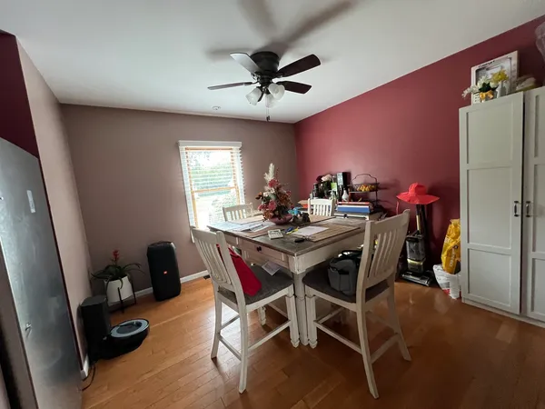 a view of a dining room with furniture and a chandelier