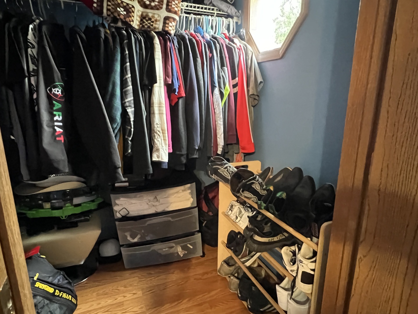 810 Peale Street Joliet, IL 60433 - Photo 9 of 17 a view of walk in closet with clothes and shoes