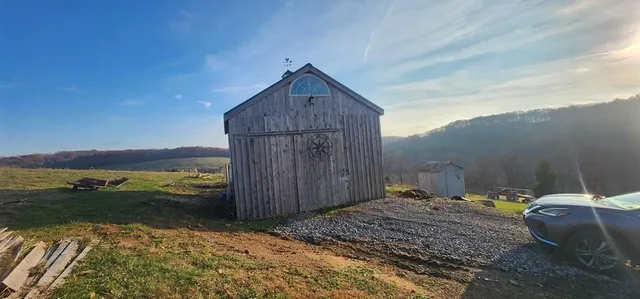 a backyard of a house with wooden fence