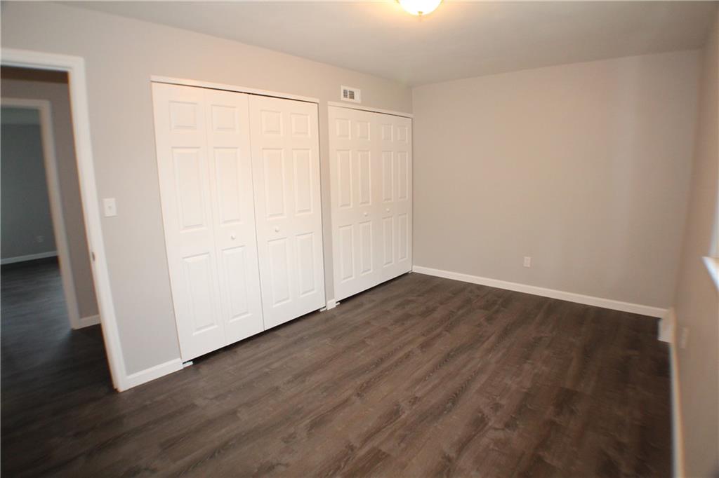 8112 A Nuttals Grove Road Pittsburgh, PA 15239 - Photo 15 of 20 a view of an empty room with wooden floor