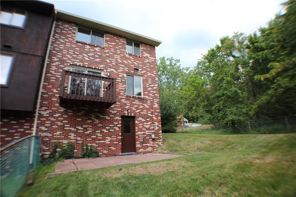 8112 A Nuttals Grove Road Pittsburgh, PA 15239 - Photo 3 of 20 a front view of a house with garden