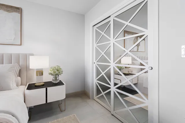 a spacious bedroom with two beds and a couch