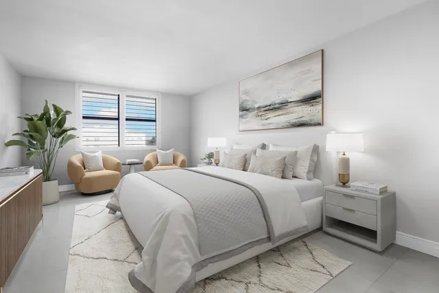 a bedroom with a bed and a couch