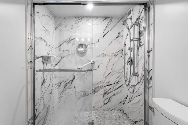 a bedroom with bed and a couch