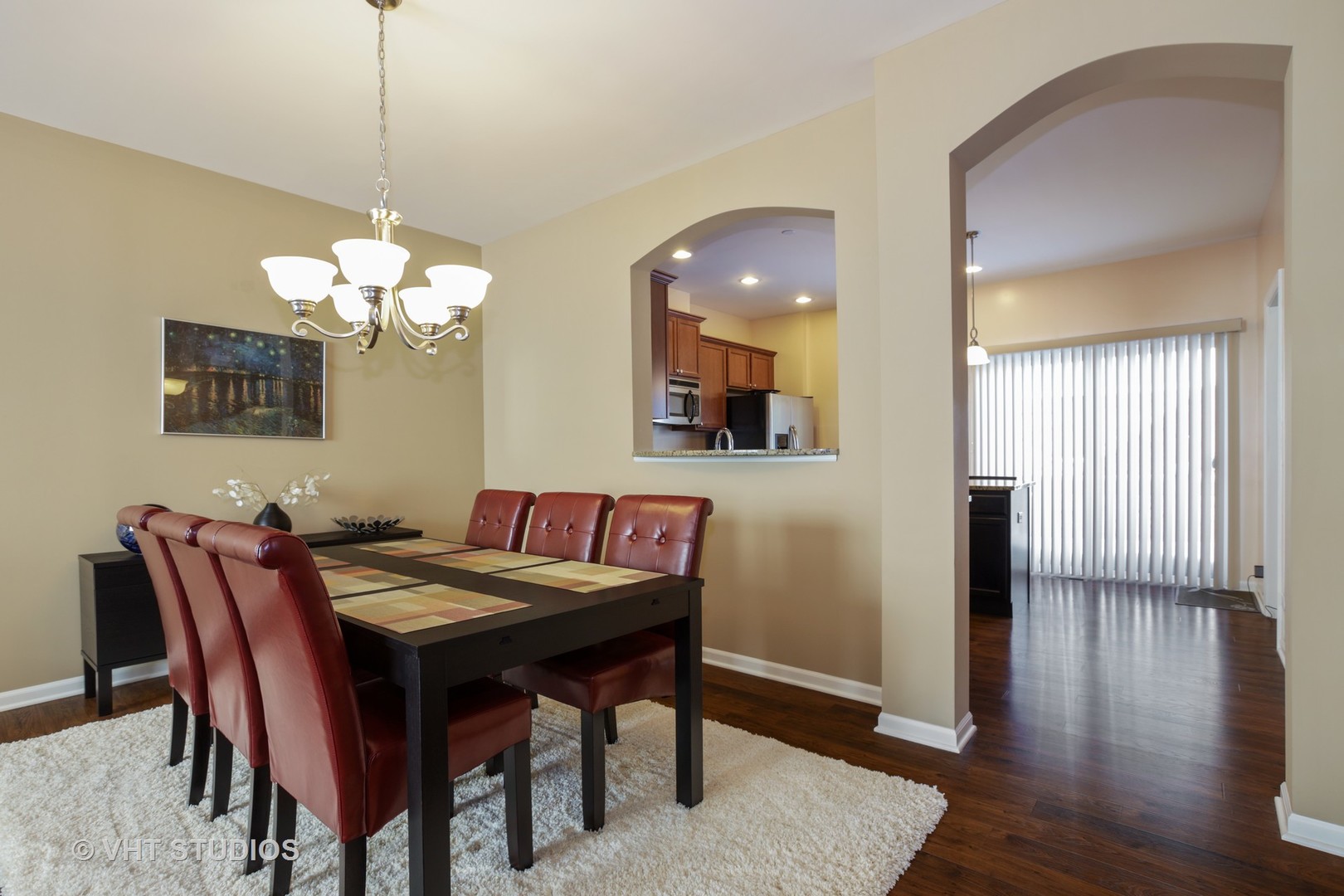 6826 Prairie Street Morton Grove, IL 60053 - Photo 5 of 16 a view of a dining room with furniture and wooden floor