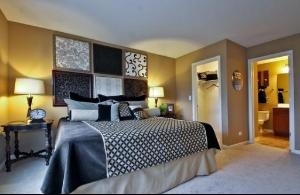 6826 Prairie Street Morton Grove, IL 60053 - Photo 8 of 16 a bedroom with a bed and wooden floor