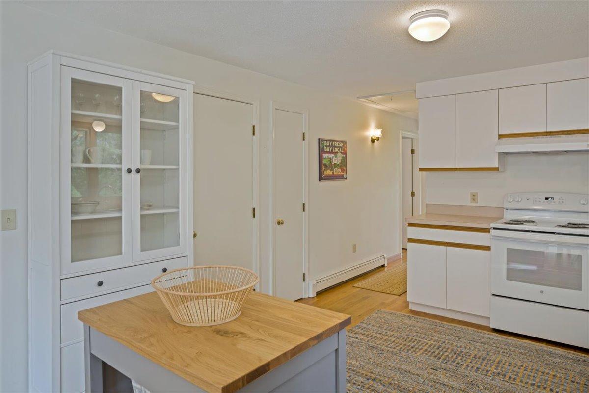 30 Warren Street Wellfleet, MA 02667 - Photo 13 of 47 a kitchen with a sink cabinets and wooden floor