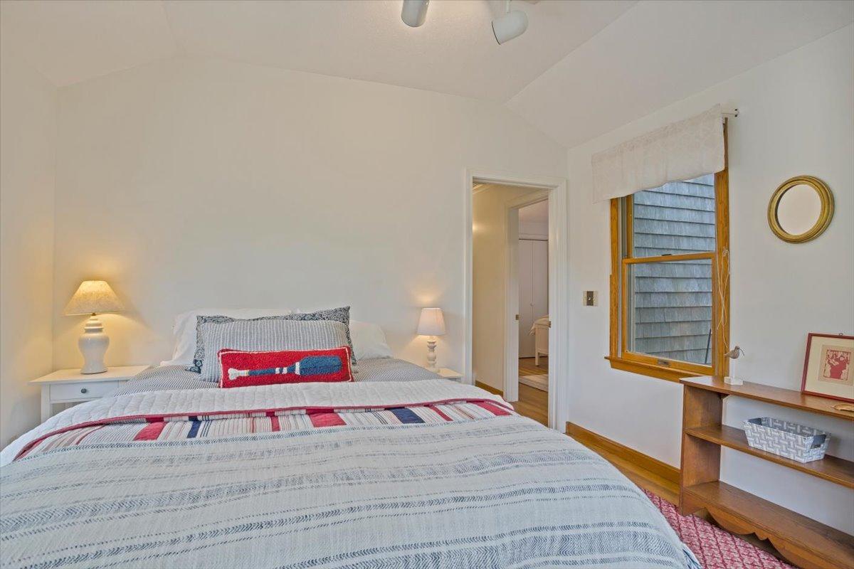 30 Warren Street Wellfleet, MA 02667 - Photo 20 of 47 a bedroom with a bed and a potted plant on the dresser