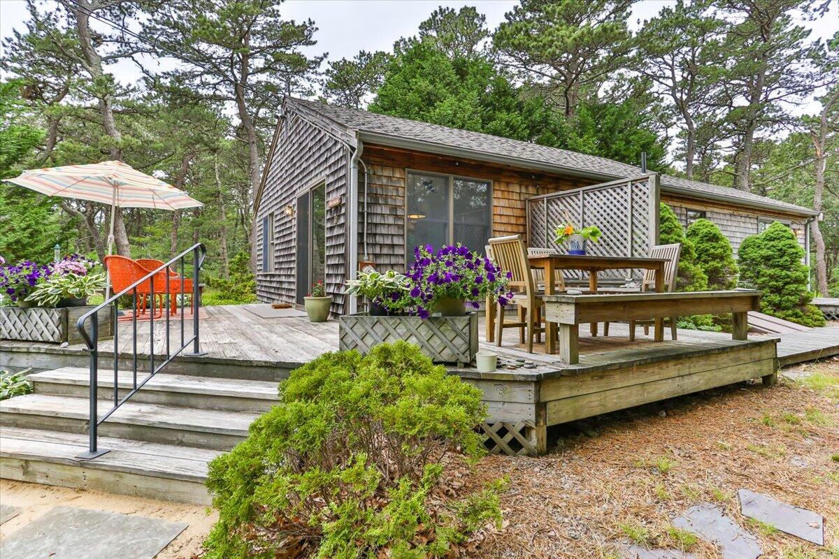 30 Warren Street Wellfleet, MA 02667 - Photo 2 of 47 a view of bench sitting in front of a house