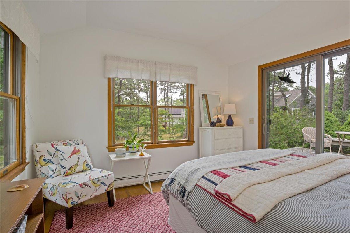 30 Warren Street Wellfleet, MA 02667 - Photo 23 of 47 a bedroom with a bed and a couch