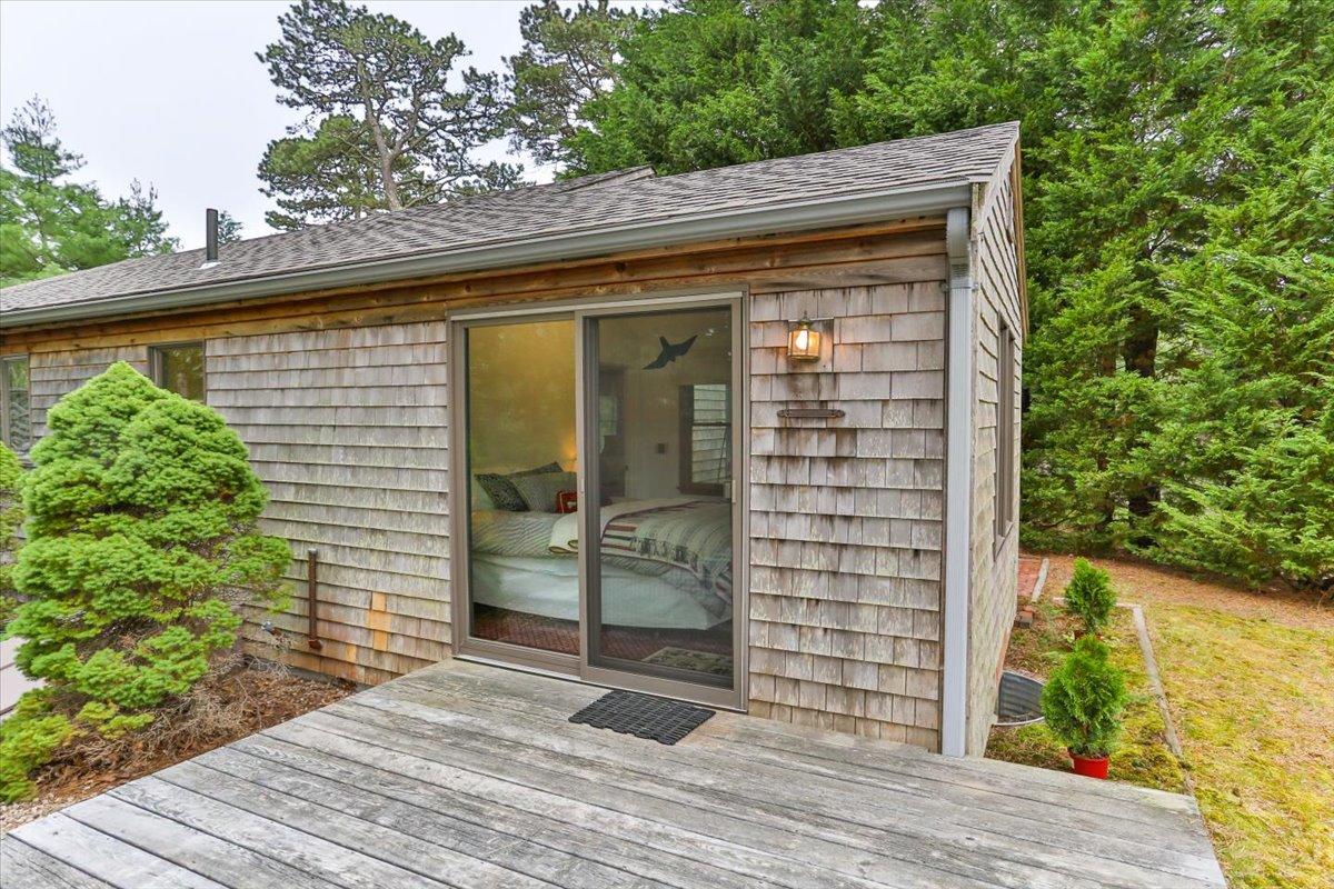 30 Warren Street Wellfleet, MA 02667 - Photo 25 of 47 a backyard of a house with seating space