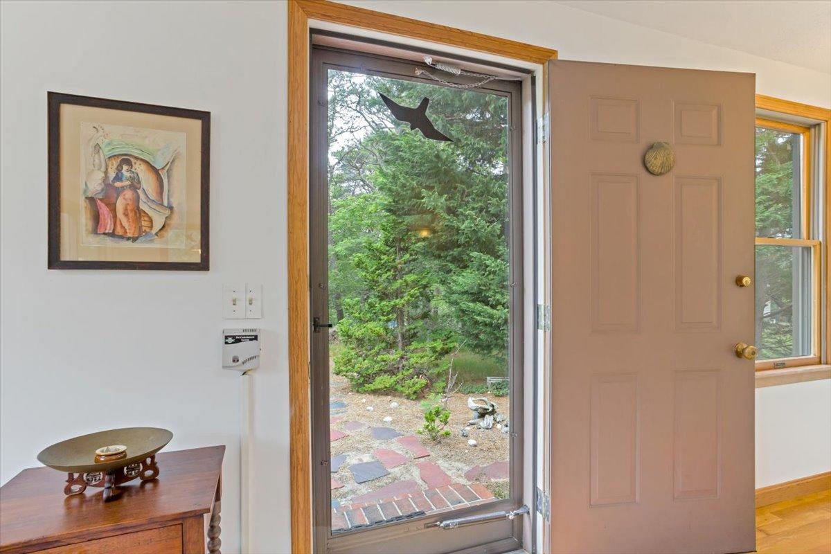 30 Warren Street Wellfleet, MA 02667 - Photo 3 of 47 an entryway with wooden floor and a hallway