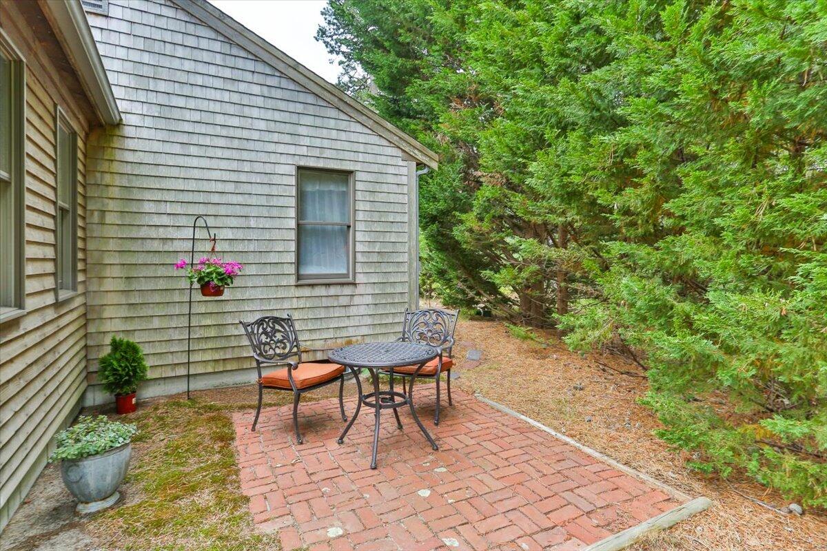 30 Warren Street Wellfleet, MA 02667 - Photo 39 of 47 a backyard of a house with seating space