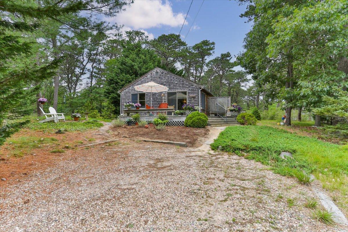 30 Warren Street Wellfleet, MA 02667 - Photo 41 of 47 a view of a house with a yard and large trees
