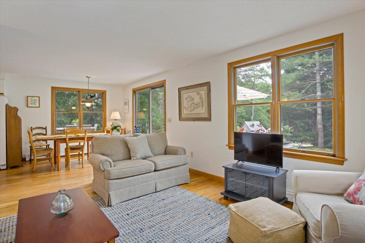 30 Warren Street Wellfleet, MA 02667 - Photo 5 of 47 a living room with furniture and a floor to ceiling window