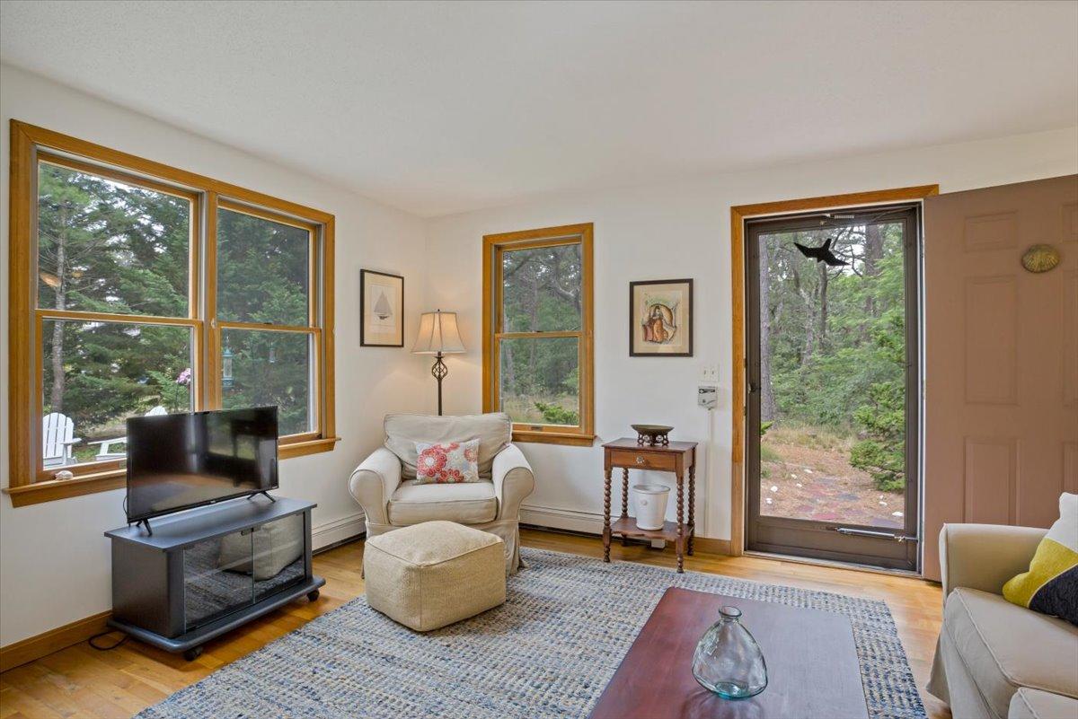 30 Warren Street Wellfleet, MA 02667 - Photo 8 of 47 a living room with furniture and a window