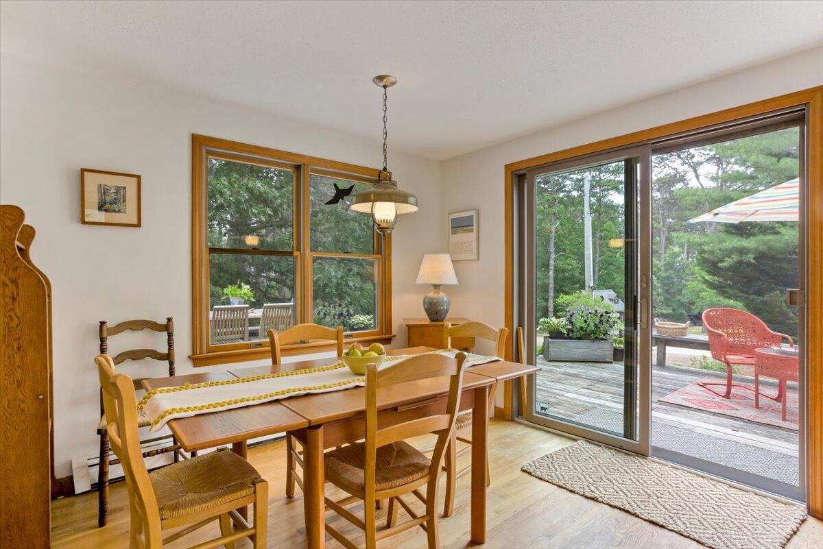30 Warren Street Wellfleet, MA 02667 - Photo 10 of 47 a dining room with furniture and a floor to ceiling window