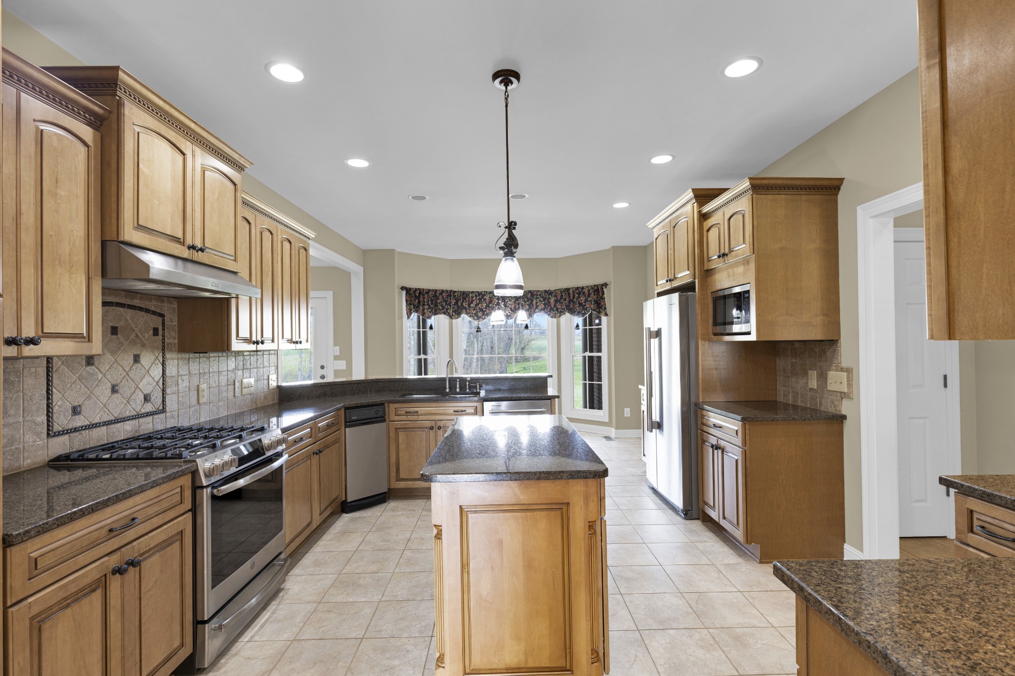 5144 Drake Road Cedar Hill, TN 37032 - Photo 43 of 80 a kitchen with stainless steel appliances granite countertop counter space a sink and cabinets