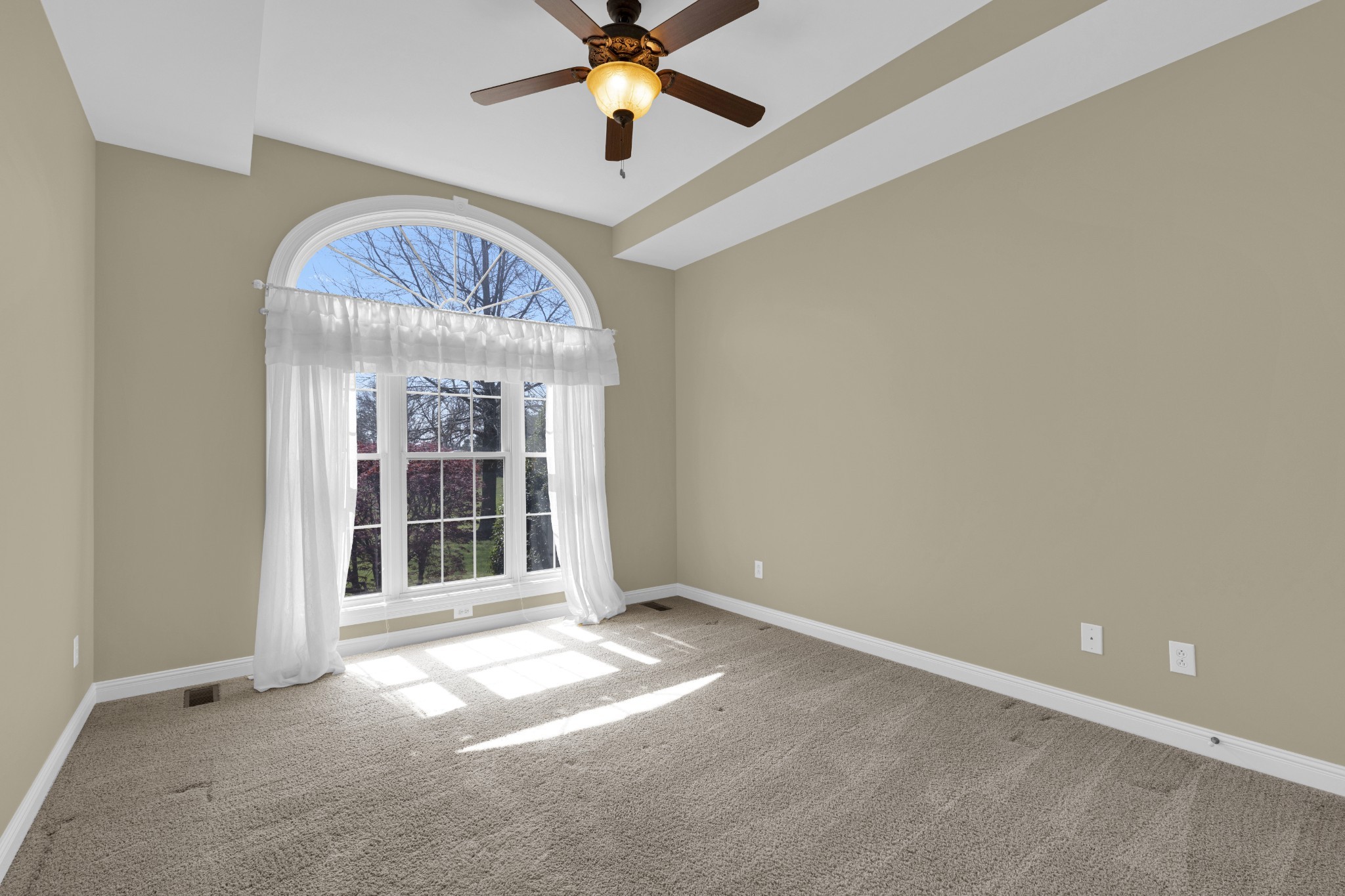 5144 Drake Road Cedar Hill, TN 37032 - Photo 57 of 80 an empty room with a chandelier fan and windows