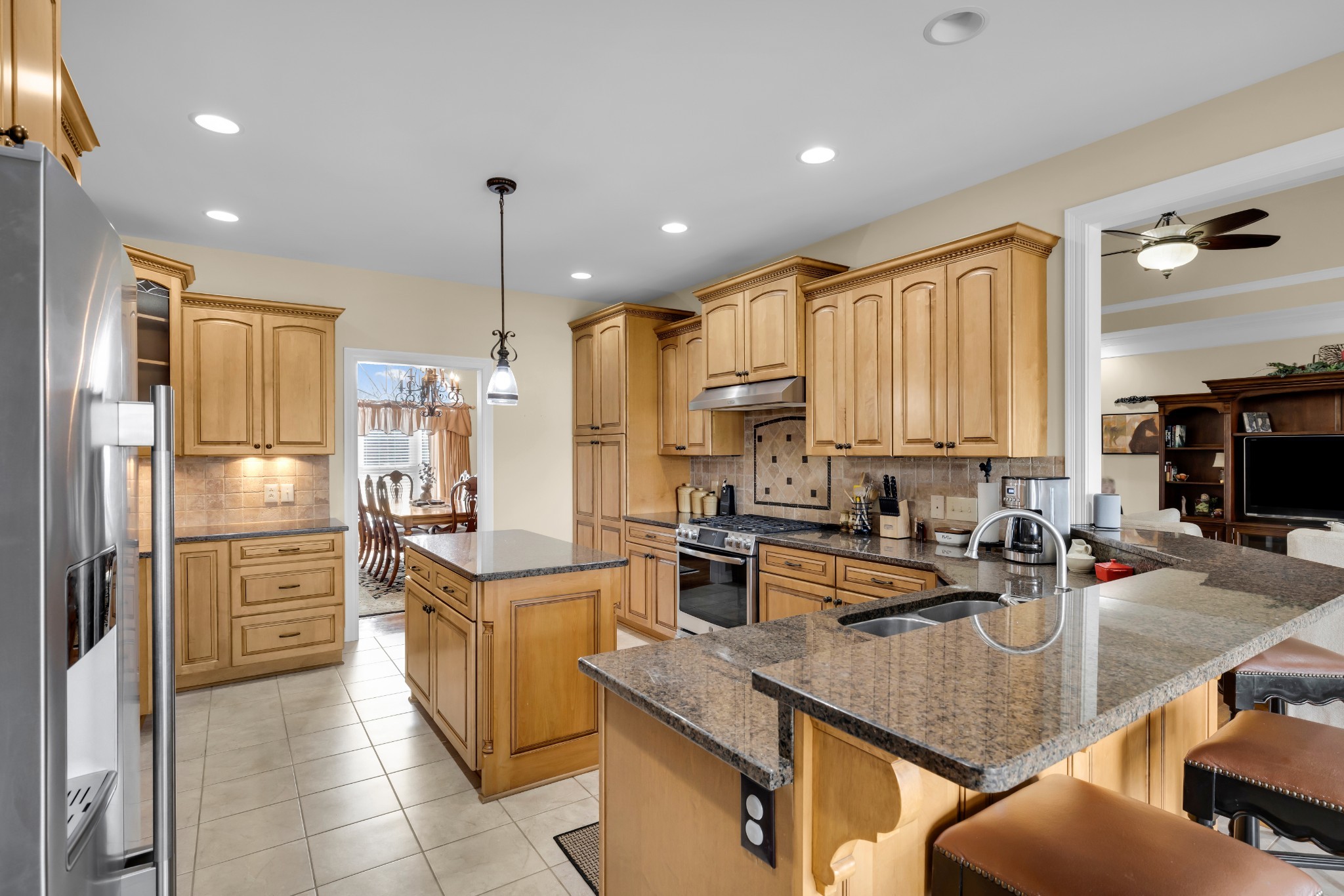 5144 Drake Road Cedar Hill, TN 37032 - Photo 10 of 80 a kitchen with a refrigerator a sink and cabinets