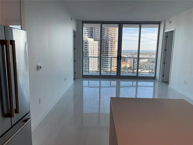 a view of an empty room with a window