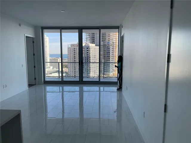 a view of an empty room with a window