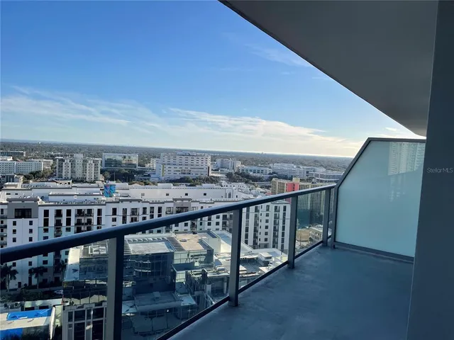 a view of a balcony with city view
